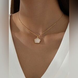 Gold rhinestone-studded sweet floral pendant necklace with white accents